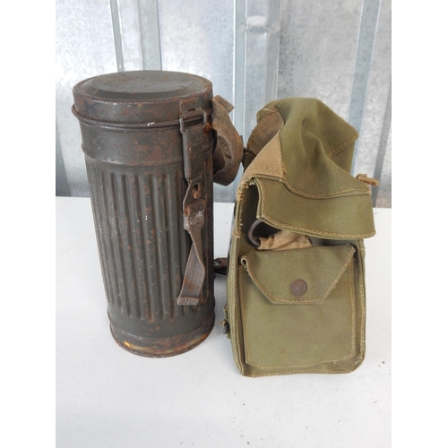 976 - WWII German Soldiers Gas Mask in Tin Cannister together with a British Soldiers Gas Mask in Canvas B... 