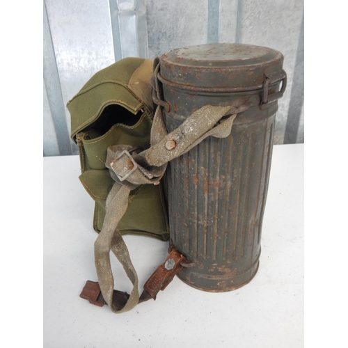 976 - WWII German Soldiers Gas Mask in Tin Cannister together with a British Soldiers Gas Mask in Canvas B... 