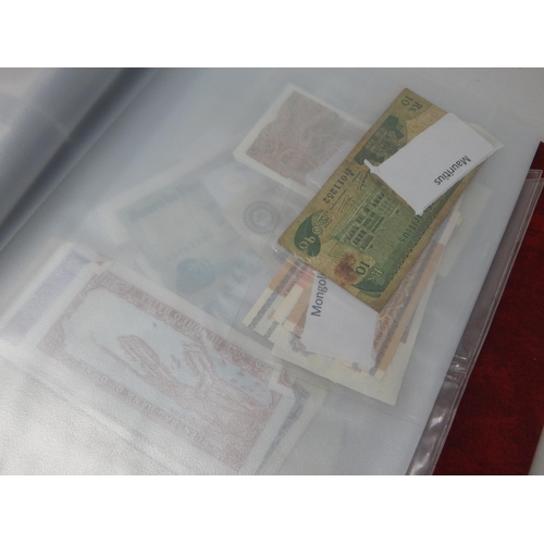 74 - A Folder Containing a Large Quantity of World Banknotes Including China, Germany, Great Britain, Ire... 