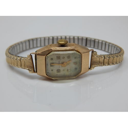 168 - 9ct Gold Ladies Wristwatch on plated strap.