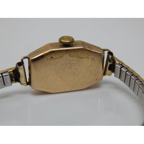 168 - 9ct Gold Ladies Wristwatch on plated strap.