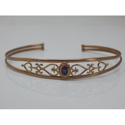 171 - 9ct Gold Bangle set with a central opal: Weight 5.05g