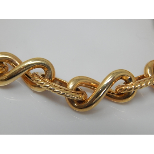 172 - 9ct Gold Fancy Link Bracelet with T-Bar Fastening: Length 21cm: Weight 12.27g