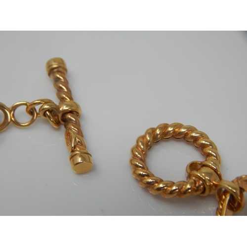 172 - 9ct Gold Fancy Link Bracelet with T-Bar Fastening: Length 21cm: Weight 12.27g