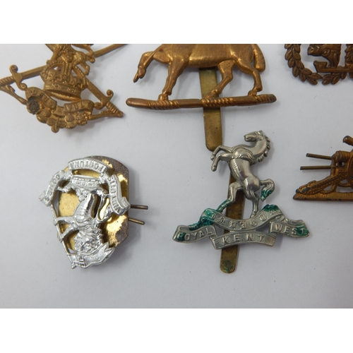 512 - Military Cap Badges Including Queen Regiment, Royal Artillery, Argyle & Sutherland etc