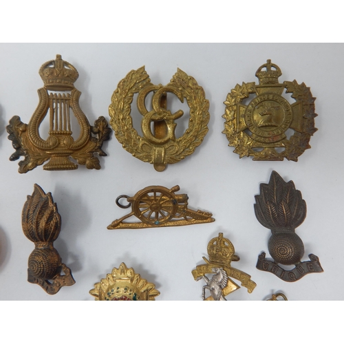 518 - Quantity of Military Cap Badges etc