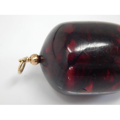 288 - Gold Mounted Large Cherry Amber? Pendant containing an Insect, possibly a spider