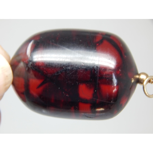 288 - Gold Mounted Large Cherry Amber? Pendant containing an Insect, possibly a spider