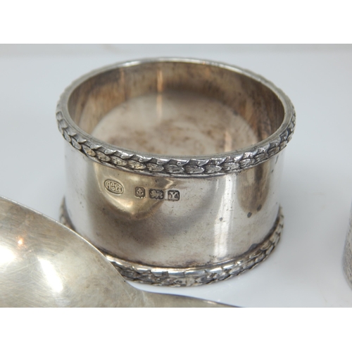 149I - Hallmarked Silver Rat Tail Serving Spoon together with two Hallmarked Silver Napkin Rings. Various D... 