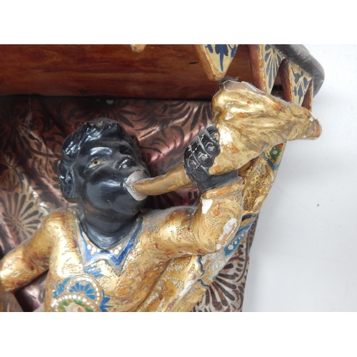 389 - A late 19th century Italian Venetian carved wood wall bracket, in the form of a blackamoor Harlequin... 