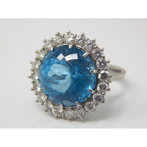 30 - Platinum Ring Set with a Large Central Topaz 15mm diameter within a Border of 20 Round Brilliant Cut... 