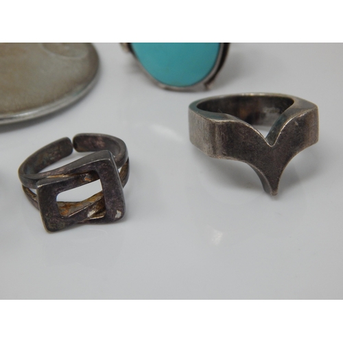 46 - A Quantity of Silver 1960's/70s Modernist Rings together with further silver rings and a large white... 