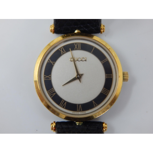 16 - GUCCI: Ladies Wristwatch, The White Dial with Black Chapter Ring & Roman Numerals on Original Gucci ... 