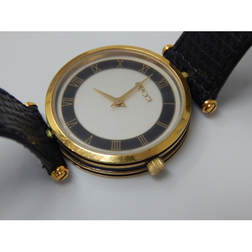 16 - GUCCI: Ladies Wristwatch, The White Dial with Black Chapter Ring & Roman Numerals on Original Gucci ... 