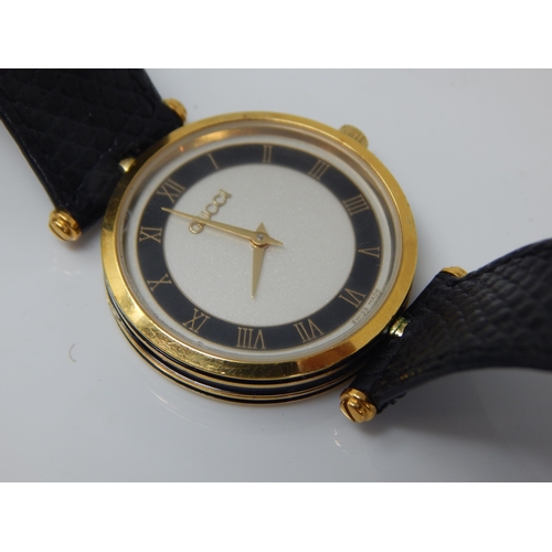 16 - GUCCI: Ladies Wristwatch, The White Dial with Black Chapter Ring & Roman Numerals on Original Gucci ... 