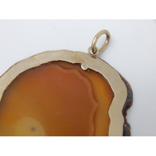 23 - GUCCI:  A Large 9ct Gold Mounted Agate Pendant Hallmarked London 1978 by Gucci: Measuring 5cm x 4cm