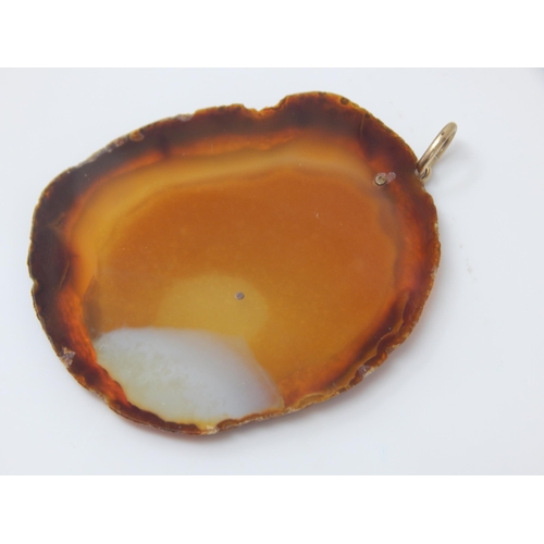 23 - GUCCI:  A Large 9ct Gold Mounted Agate Pendant Hallmarked London 1978 by Gucci: Measuring 5cm x 4cm