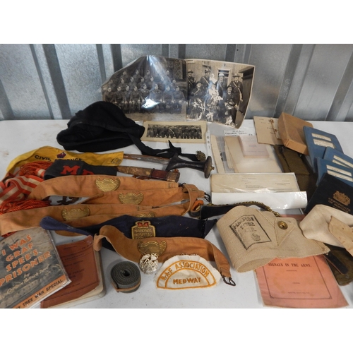 Box of interesting military items including ephemera, an ethnic dagger etc