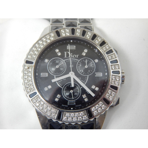 162B - Dior: A Christian Dior Christal diamond set bracelet watch, the black chronograph dial set with 14 r... 