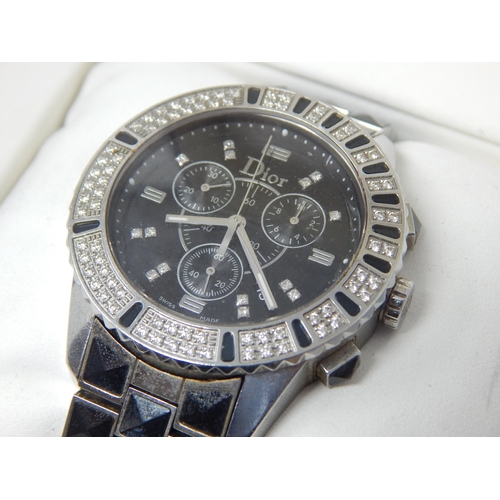 162B - Dior: A Christian Dior Christal diamond set bracelet watch, the black chronograph dial set with 14 r... 