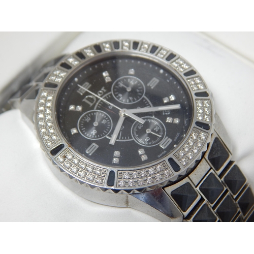 162B - Dior: A Christian Dior Christal diamond set bracelet watch, the black chronograph dial set with 14 r... 