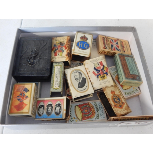 753 - A large quantity of military related match box holders and some empty cigarette boxes