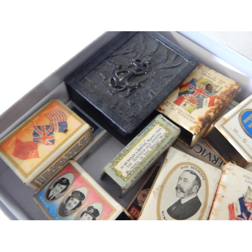 753 - A large quantity of military related match box holders and some empty cigarette boxes