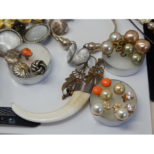 299C - A Quantity of Vintage Costume Jewellery including Silver Mounted Tusk Pendant, Bangles, Earrings etc... 