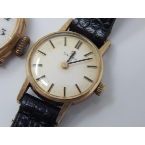 162R - 9ct Gold Omega Ladies Wristwatch on Black Leather Strap together with a further 9ct Gold Wristwatch ... 