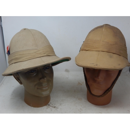 756 - WWII British Military Tropical Helmets (2) one with brass chin strap