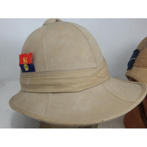 756 - WWII British Military Tropical Helmets (2) one with brass chin strap