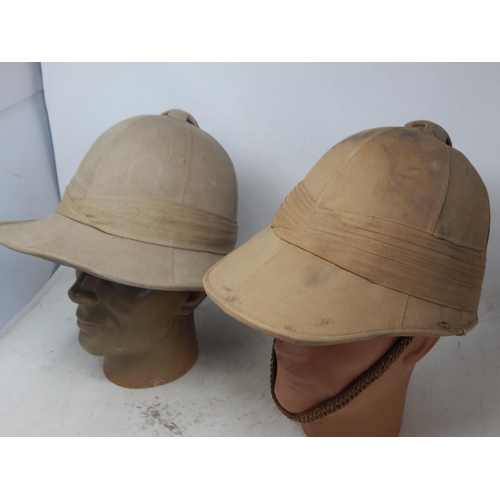 756 - WWII British Military Tropical Helmets (2) one with brass chin strap