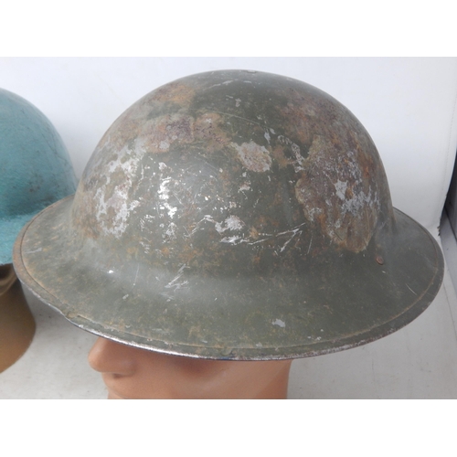 763 - WWI Raw Edge Steel Helmet (painted) together with a WWII Steel Brodie Helmet (2)