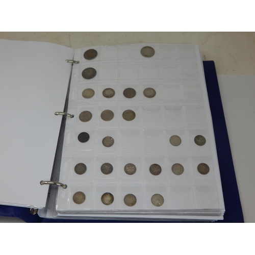 99L - A Coin Album containing a large quantity of British & foreign coinage including silver dating 18th c... 