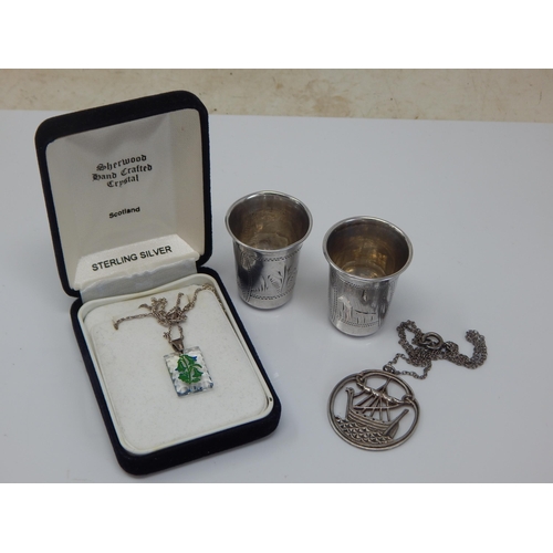 100P - A Pair of Late 19th Century Russian Silver Vodka Cups together with a Silver Iona Galleon Pendant Ne... 