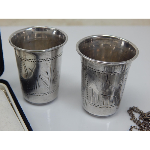 100P - A Pair of Late 19th Century Russian Silver Vodka Cups together with a Silver Iona Galleon Pendant Ne... 