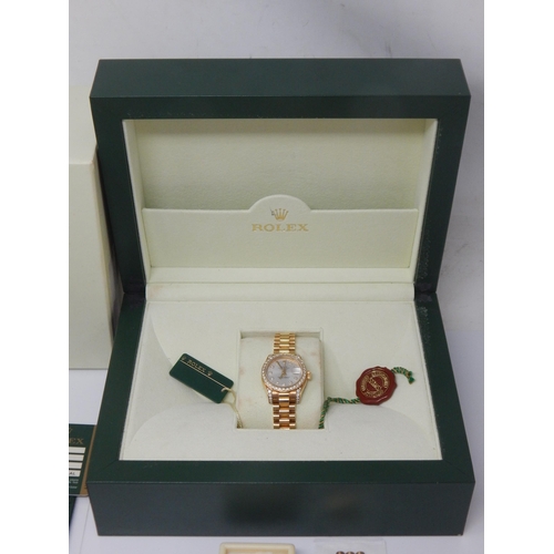 150A - ROLEX: Ladies 18ct Gold Rolex Oyster Perpetual Datejust 2009 (Ref. 179238) Serial No. V---324. White... 