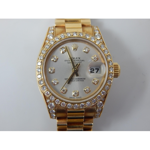 150A - ROLEX: Ladies 18ct Gold Rolex Oyster Perpetual Datejust 2009 (Ref. 179238) Serial No. V---324. White... 