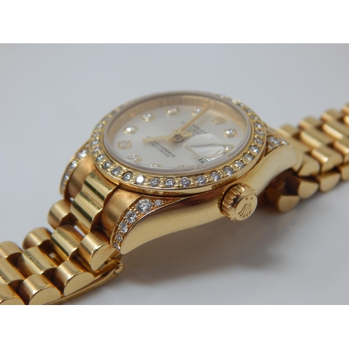 150A - ROLEX: Ladies 18ct Gold Rolex Oyster Perpetual Datejust 2009 (Ref. 179238) Serial No. V---324. White... 