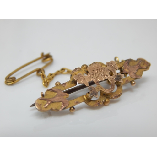 132 - Victorian bi-colour 9ct swallow and flower basket brooch with safety chain - 2g gross