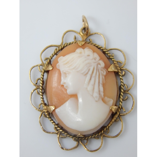 139 - Vintage shell-cameo profile pendant in Birmingham hallmarked 9ct gold scalloped mount - 40mm incl ba... 