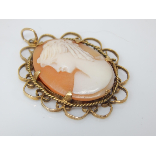 139 - Vintage shell-cameo profile pendant in Birmingham hallmarked 9ct gold scalloped mount - 40mm incl ba... 