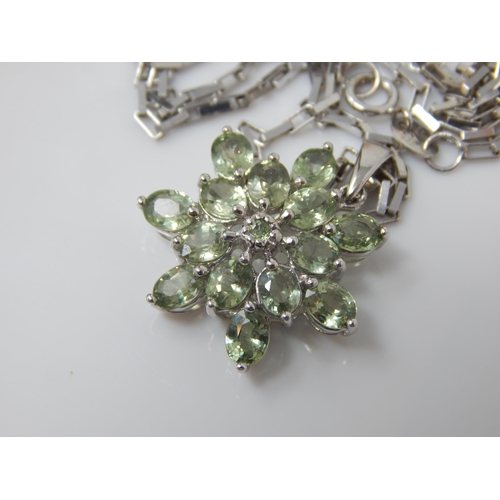 140 - A green sapphire star pendant set in 9ct white gold (24mm incl bale) on matching large link chain (4... 