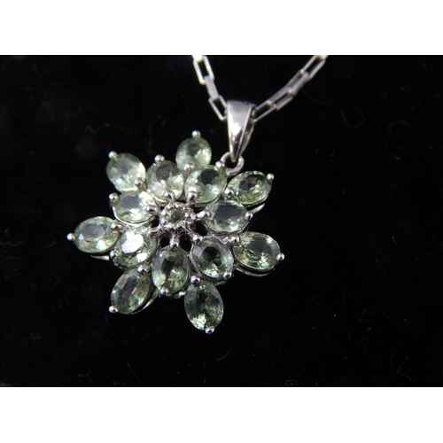 140 - A green sapphire star pendant set in 9ct white gold (24mm incl bale) on matching large link chain (4... 