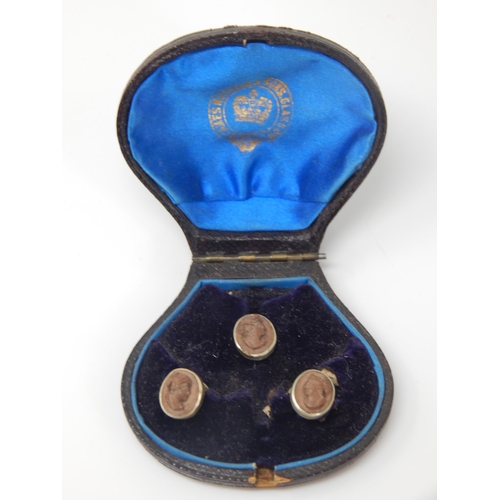 144 - A set of Victorian lava cameo carved profile shirt studs in original Glasgow retailers silk and leat... 