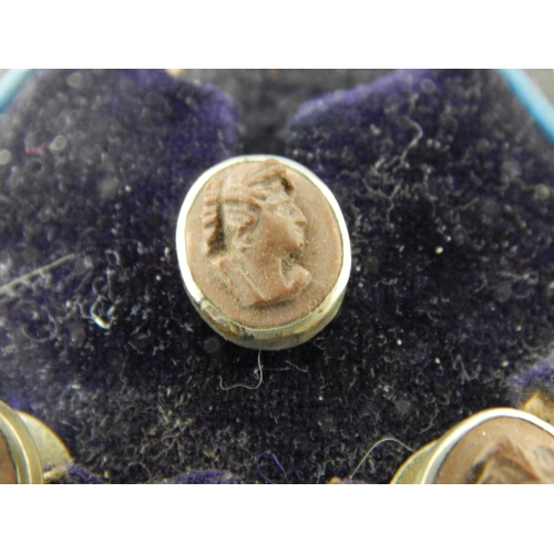 144 - A set of Victorian lava cameo carved profile shirt studs in original Glasgow retailers silk and leat... 