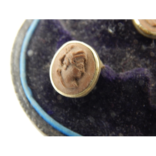 144 - A set of Victorian lava cameo carved profile shirt studs in original Glasgow retailers silk and leat... 