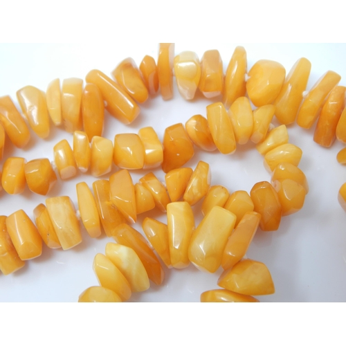 150 - A necklace of polished butterscotch amber free-form beads