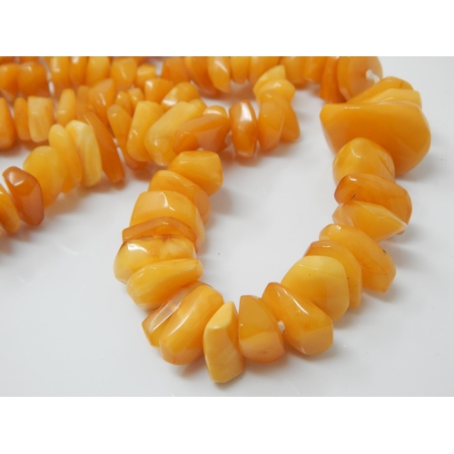 150 - A necklace of polished butterscotch amber free-form beads