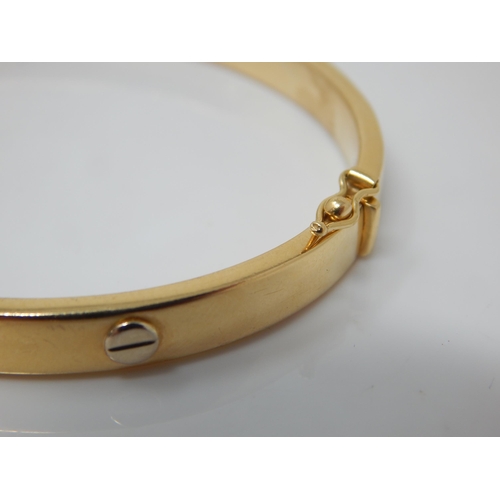 86 - 18ct Gold Hinged Bangle: Weight 19.64g